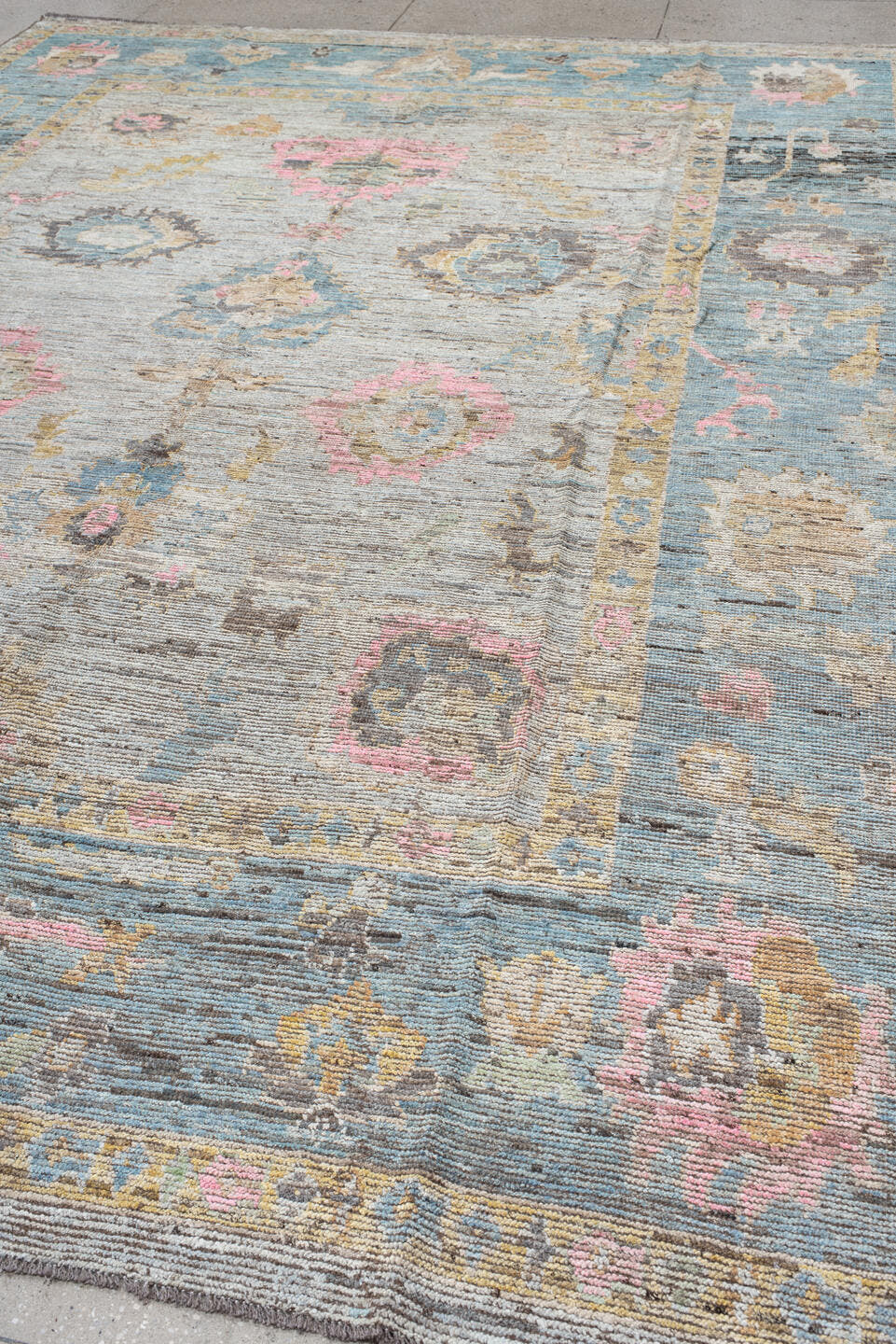 10' x 13' one-of-a-kind handmade vintage Oushak large size rug. Color palette: ivory, pale blue, blush, taupe, gold
