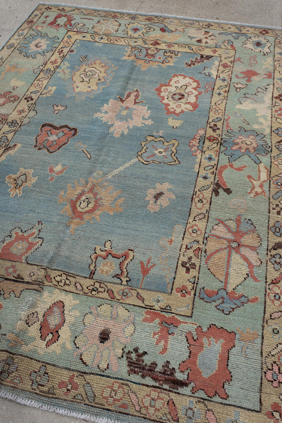 5' x 7' one-of-a-kind handmade vintage Oushak medium size rug. Color palette: sky blue, ivory, sage, rust, rose, taupe