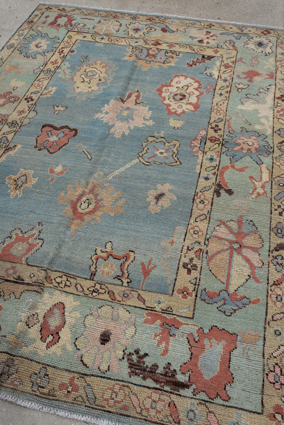 5' x 7' one-of-a-kind handmade vintage Oushak medium size rug. Color palette: sky blue, ivory, sage, rust, rose, taupe