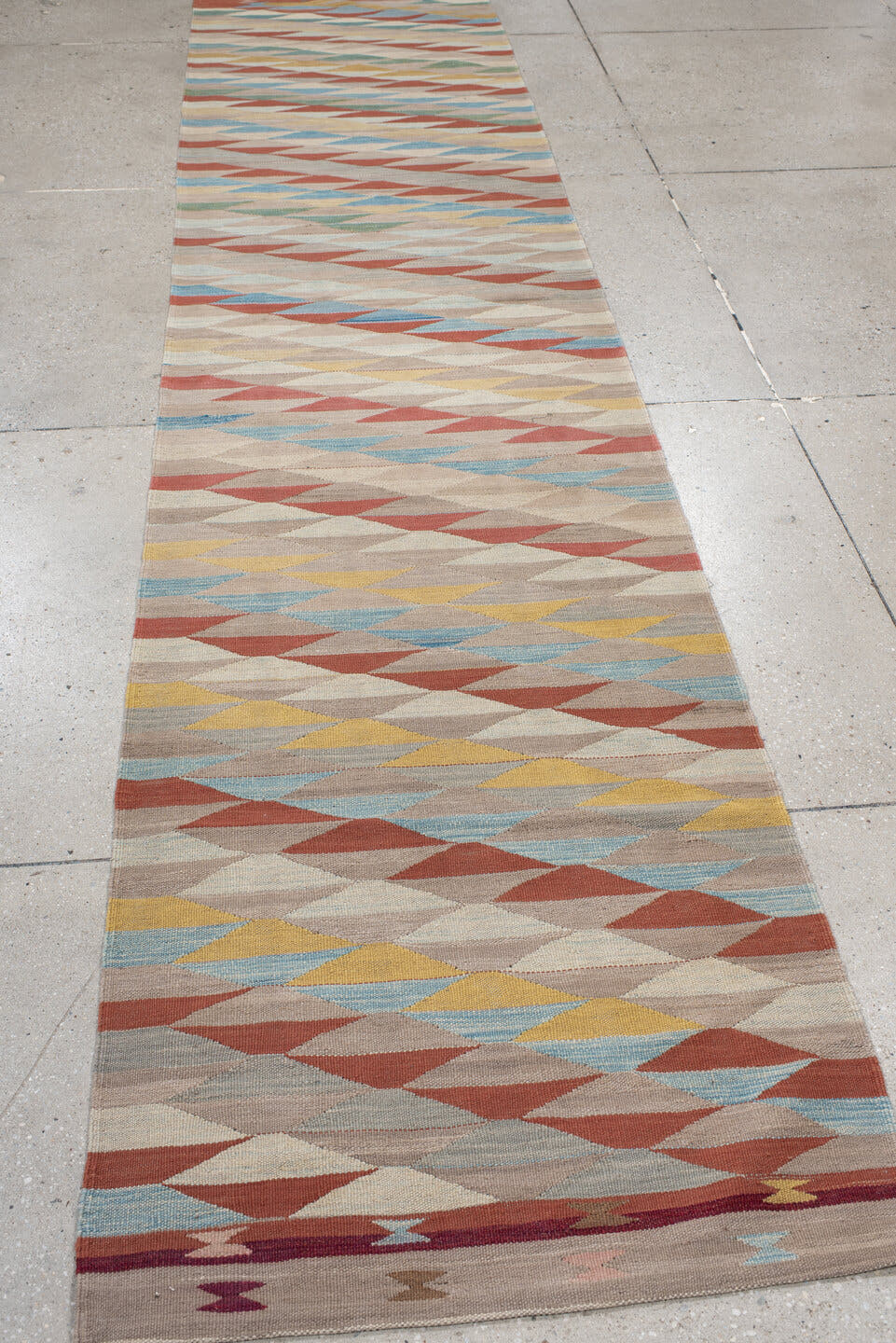 2' x 12' one-of-a-kind handmade vintage Kilim runner rug. Color palette: taupe, ivory, rust, sky blue, sage, gold, rose