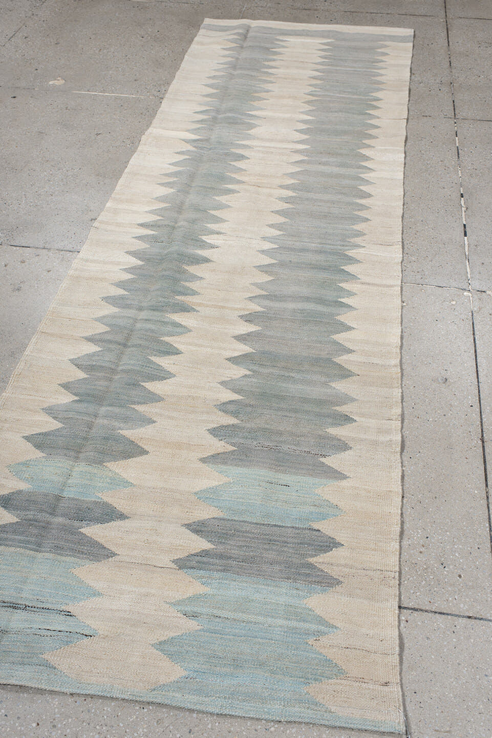 3' x 9' one-of-a-kind handmade vintage Kilim runner rug. Color palette: ivory, gray, pale blue, cream, light blue