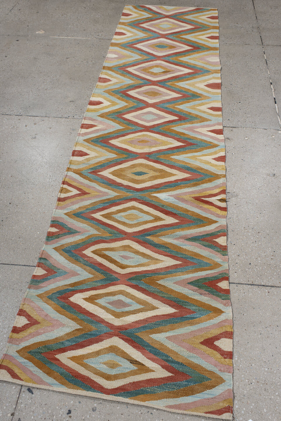 2' x 9' one-of-a-kind handmade vintage Kilim runner rug. Color palette: ivory, gold, rust, blush, teal, camel, pale blue