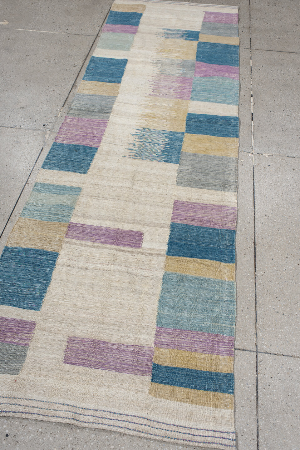 2' x 9' one-of-a-kind handmade vintage Kilim runner rug. Color palette: ivory, teal, lavender, light blue, gray, sand