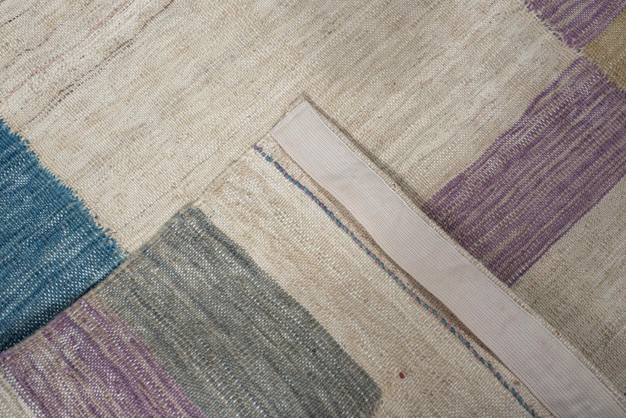 2' x 9' one-of-a-kind handmade vintage Kilim runner rug. Color palette: ivory, teal, lavender, light blue, gray, sand