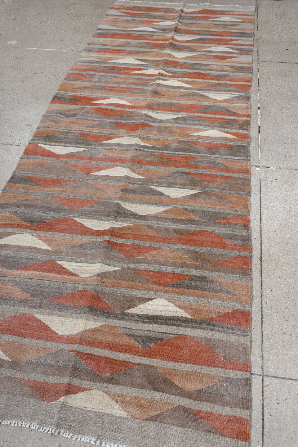3' x 9' one-of-a-kind handmade vintage Kilim runner rug. Color palette: taupe, rust, terra cotta, gray, ivory, peach, beige