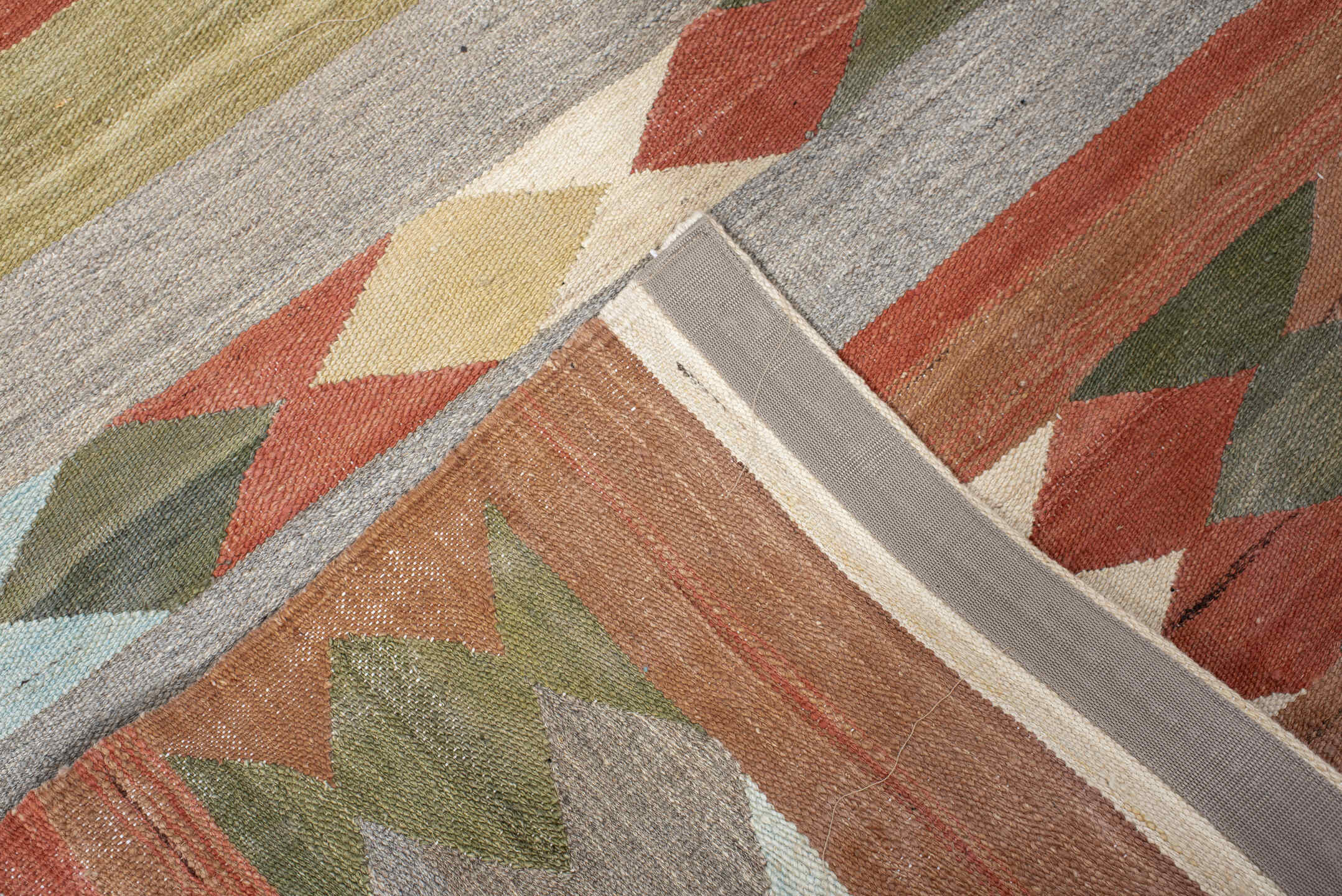 3' x 9' one-of-a-kind handmade vintage Kilim runner rug. Color palette: brown, gray, light gray, off-white, pink, red
