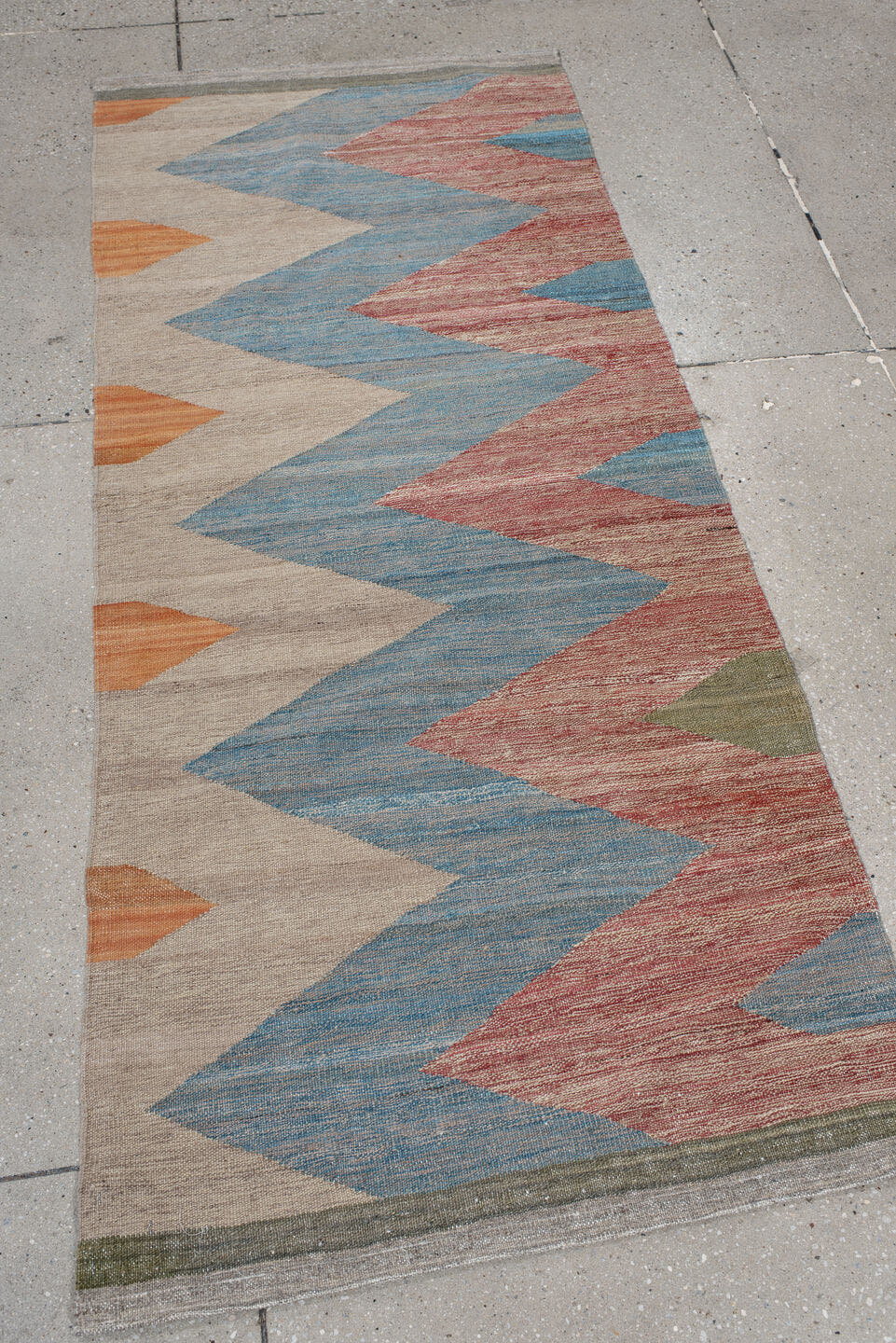 2' x 6' one-of-a-kind handmade vintage Kilim runner rug. Color palette: ivory, sky blue, rust, orange, olive, gray