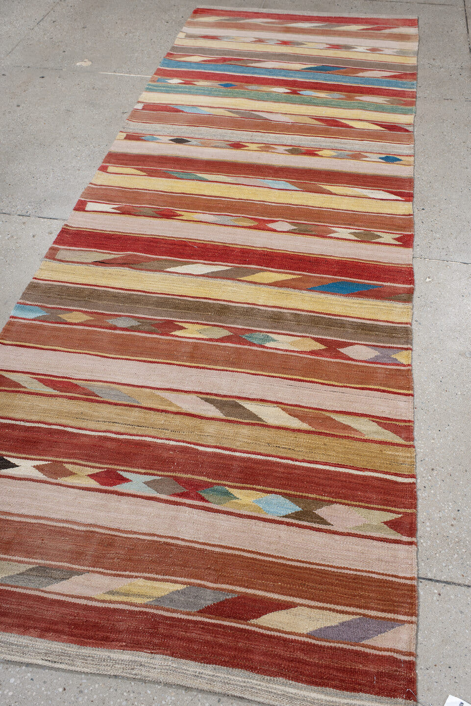 3' x 9' one-of-a-kind handmade vintage Kilim runner rug. Color palette: terra cotta, ivory, camel, taupe, rust, muted blue