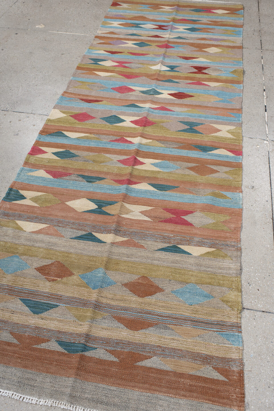 3' x 10' one-of-a-kind handmade vintage Kilim runner rug. Color palette: taupe, sky blue, terra cotta, olive, ivory, rose