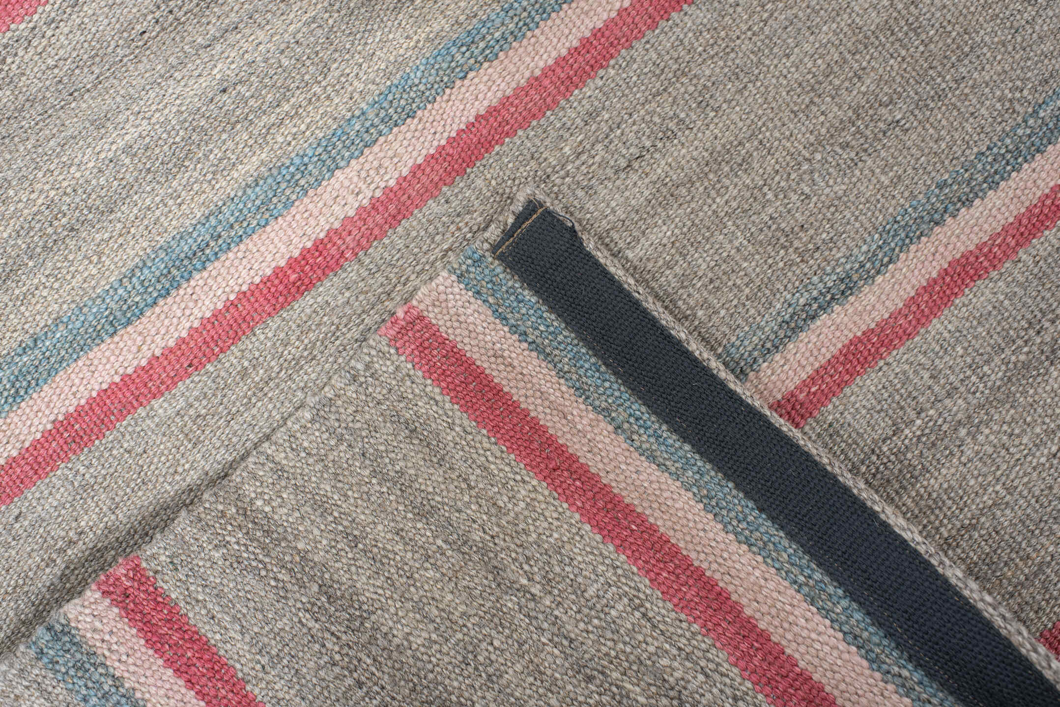 2' x 7' one-of-a-kind handmade vintage Kilim runner rug. Color palette: black, brown, dark gray, gray, light gray, pink, red