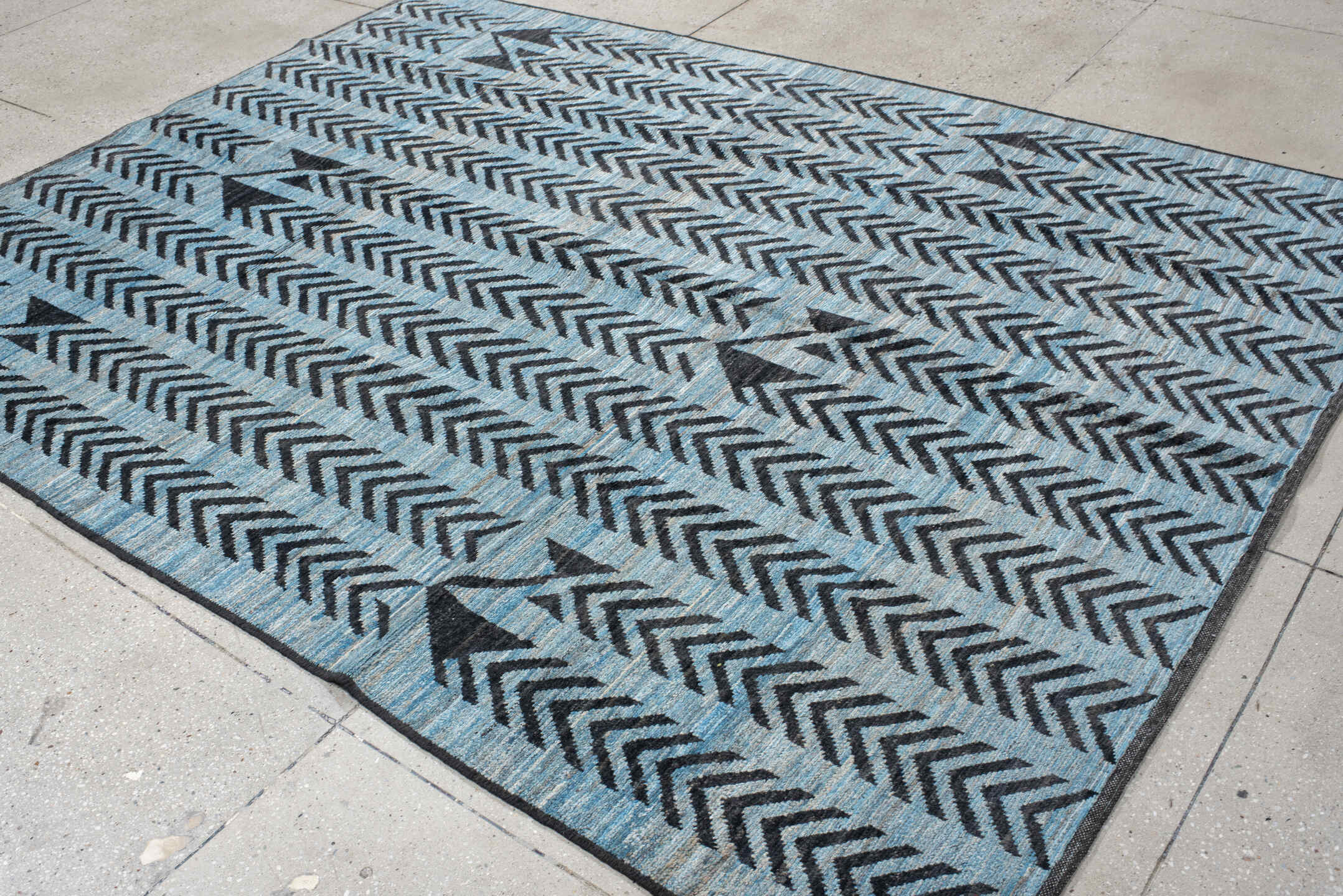 6' x 9' one-of-a-kind handmade vintage Tulu medium size rug. Color palette: sky blue, charcoal, slate, black, light blue