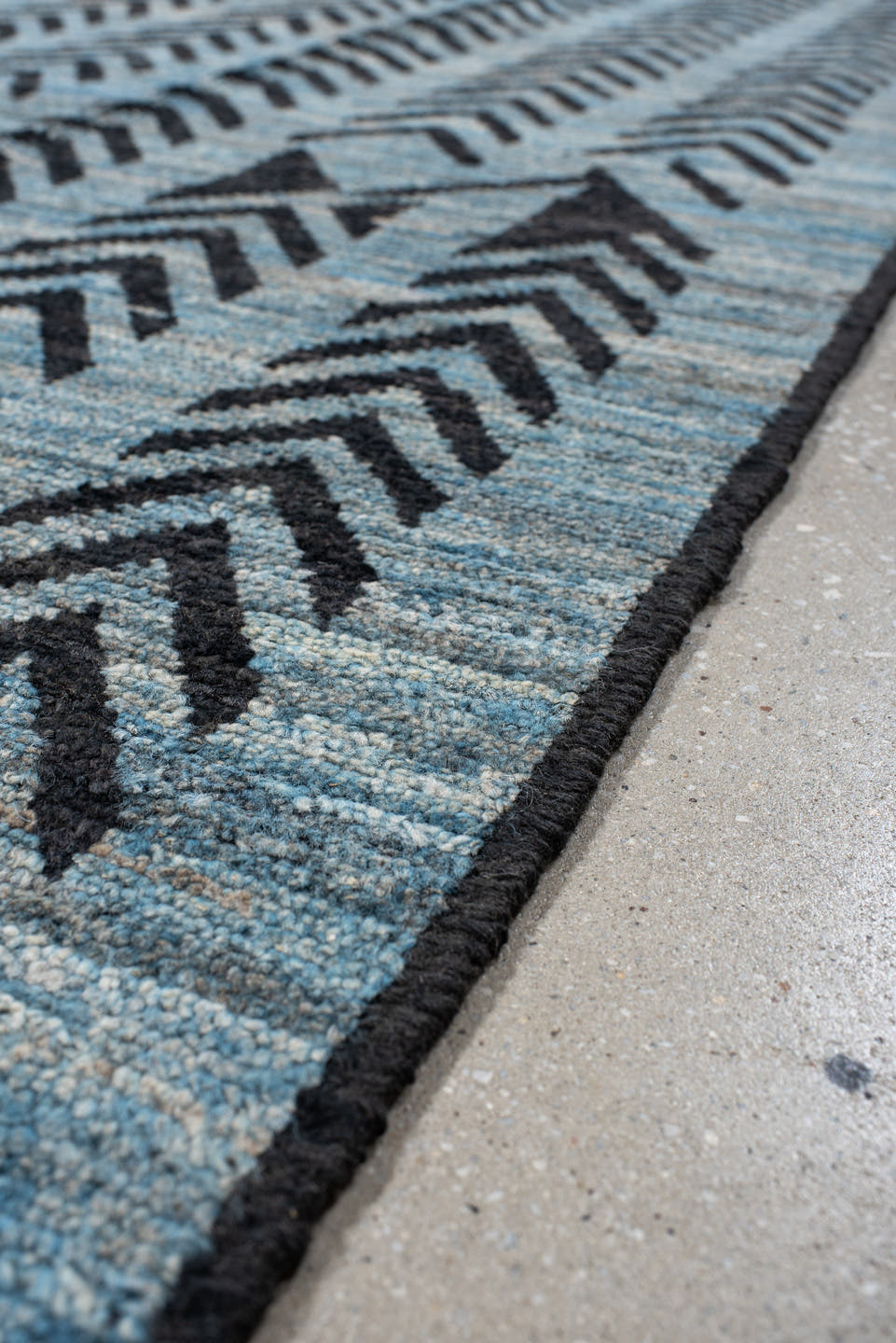 6' x 9' one-of-a-kind handmade vintage Tulu medium size rug. Color palette: sky blue, charcoal, slate, black, light blue