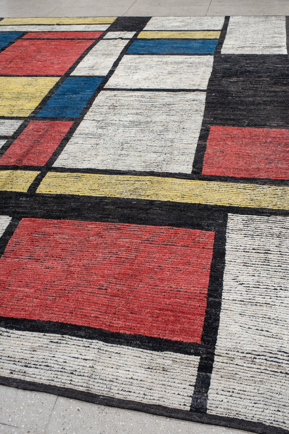 10' x 14' one-of-a-kind handmade vintage Tulu large size rug. Color palette: ivory, black, blue, red, yellow, gold