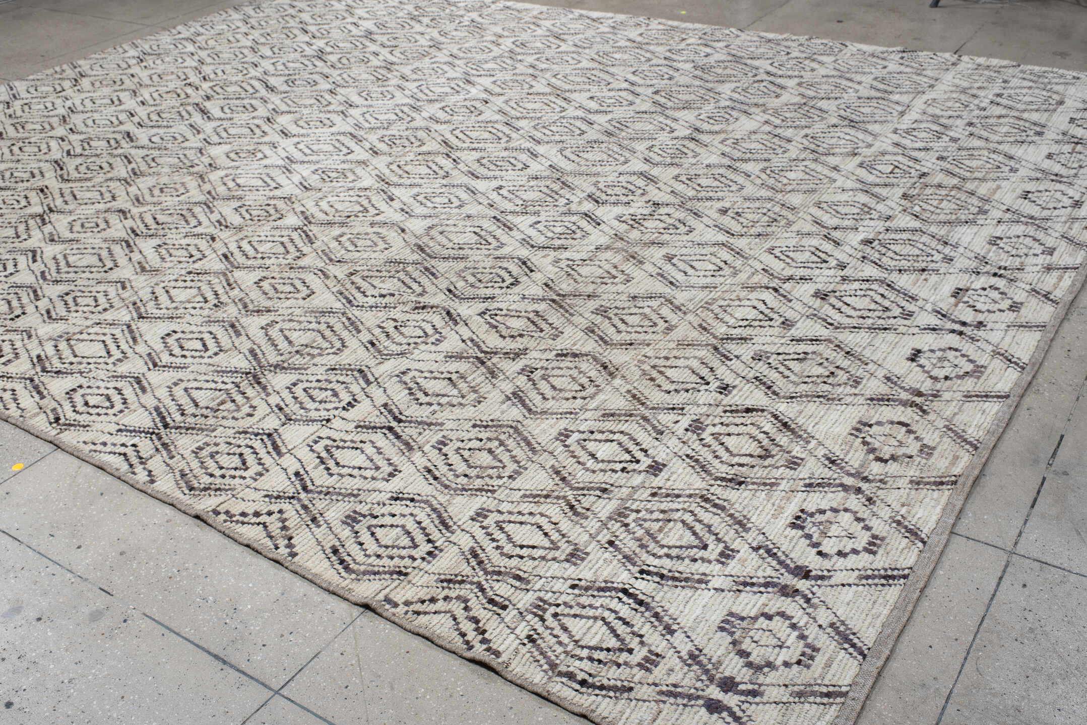 12' x 14' one-of-a-kind handmade vintage Tulu oversize rug. Color palette: ivory, charcoal, taupe, brown, gray, black, beige