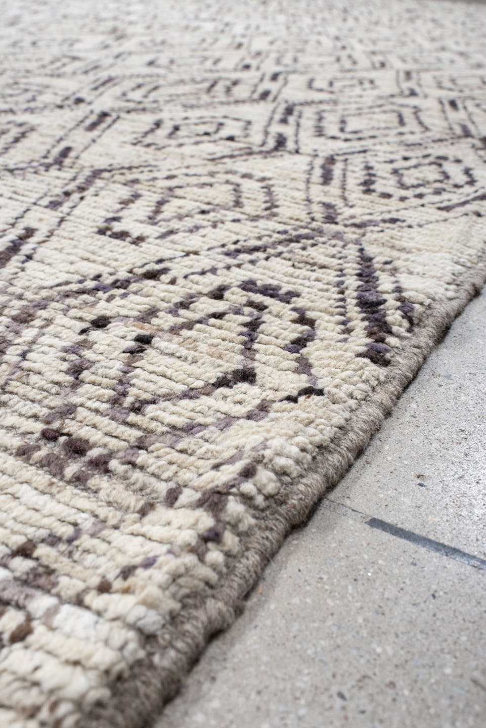 12' x 14' one-of-a-kind handmade vintage Tulu oversize rug. Color palette: ivory, charcoal, taupe, brown, gray, black, beige