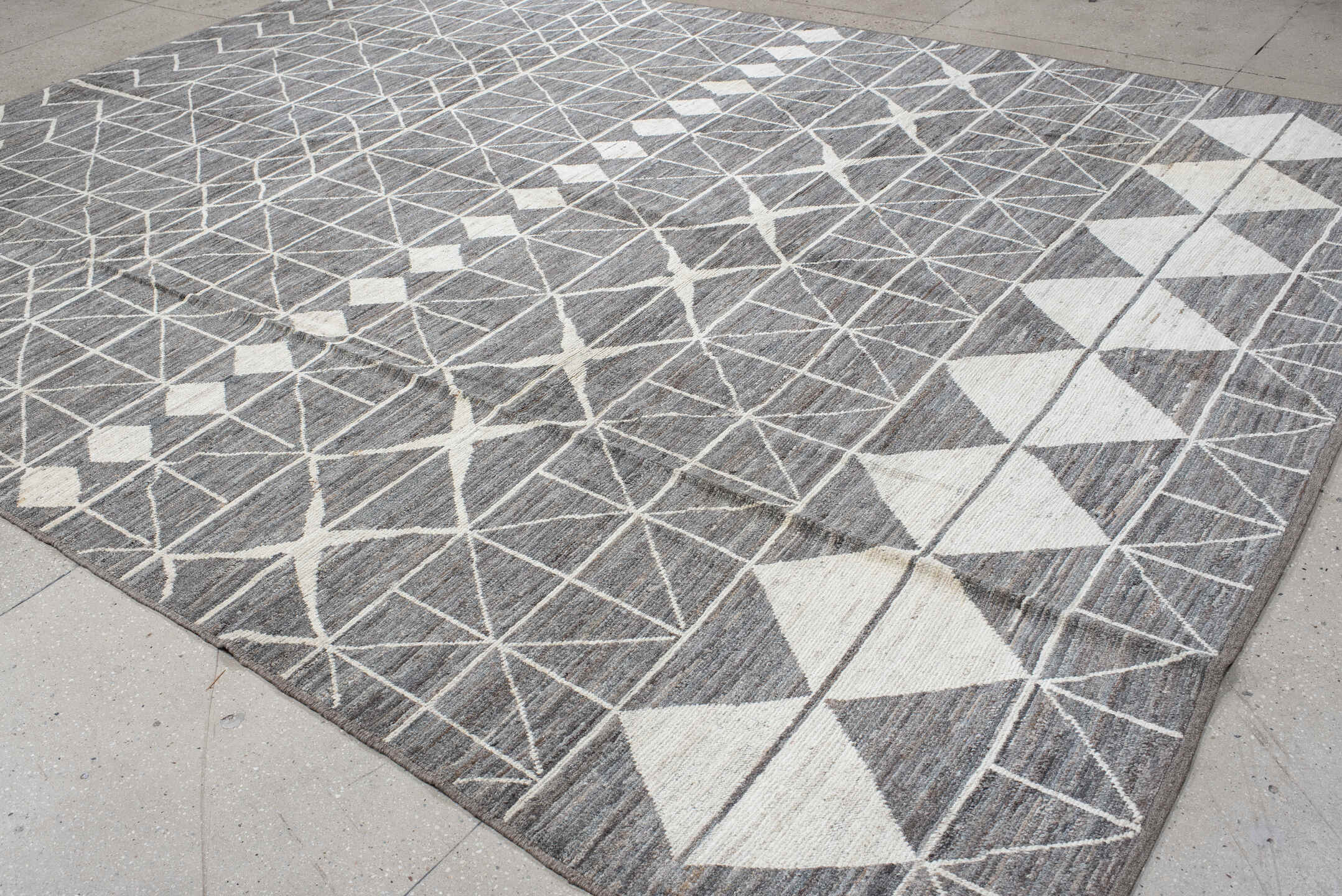 9' x 13' one-of-a-kind handmade vintage Tulu large size rug. Color palette: gray, ivory, charcoal, taupe, black, beige