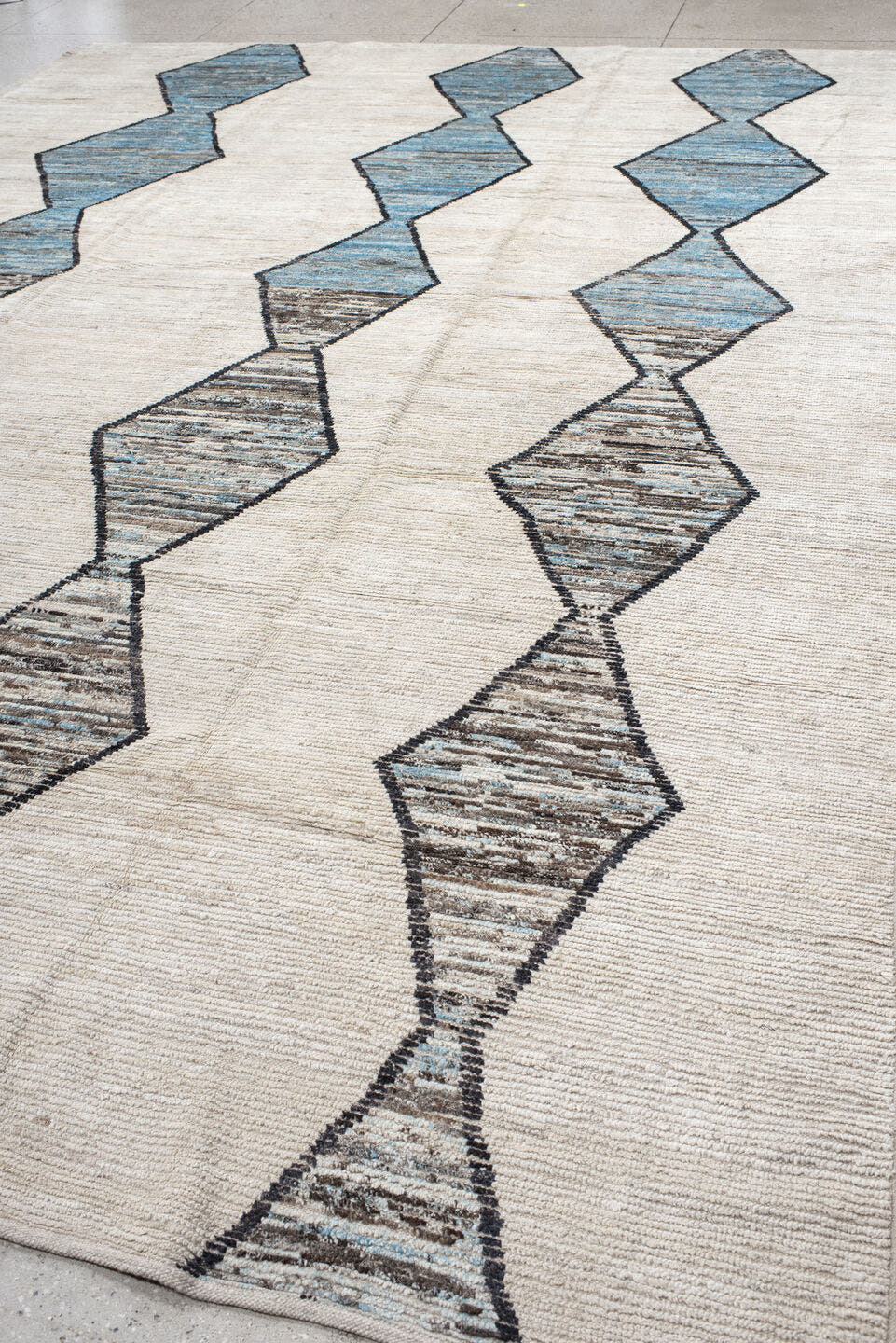 11' x 15' one-of-a-kind handmade vintage Tulu oversize rug. Color palette: ivory, sky blue, taupe, charcoal, cream