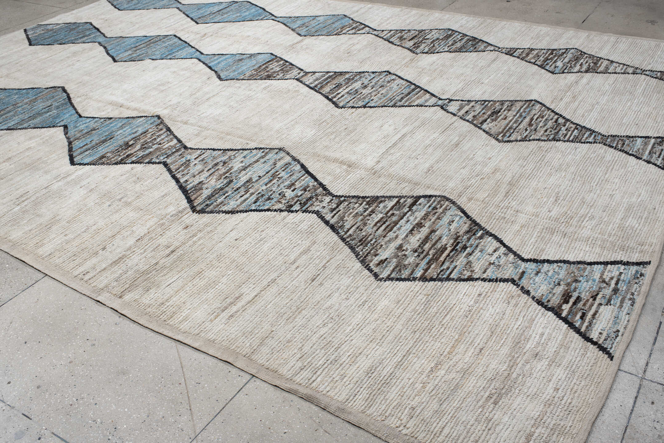 11' x 15' one-of-a-kind handmade vintage Tulu oversize rug. Color palette: ivory, sky blue, taupe, charcoal, cream