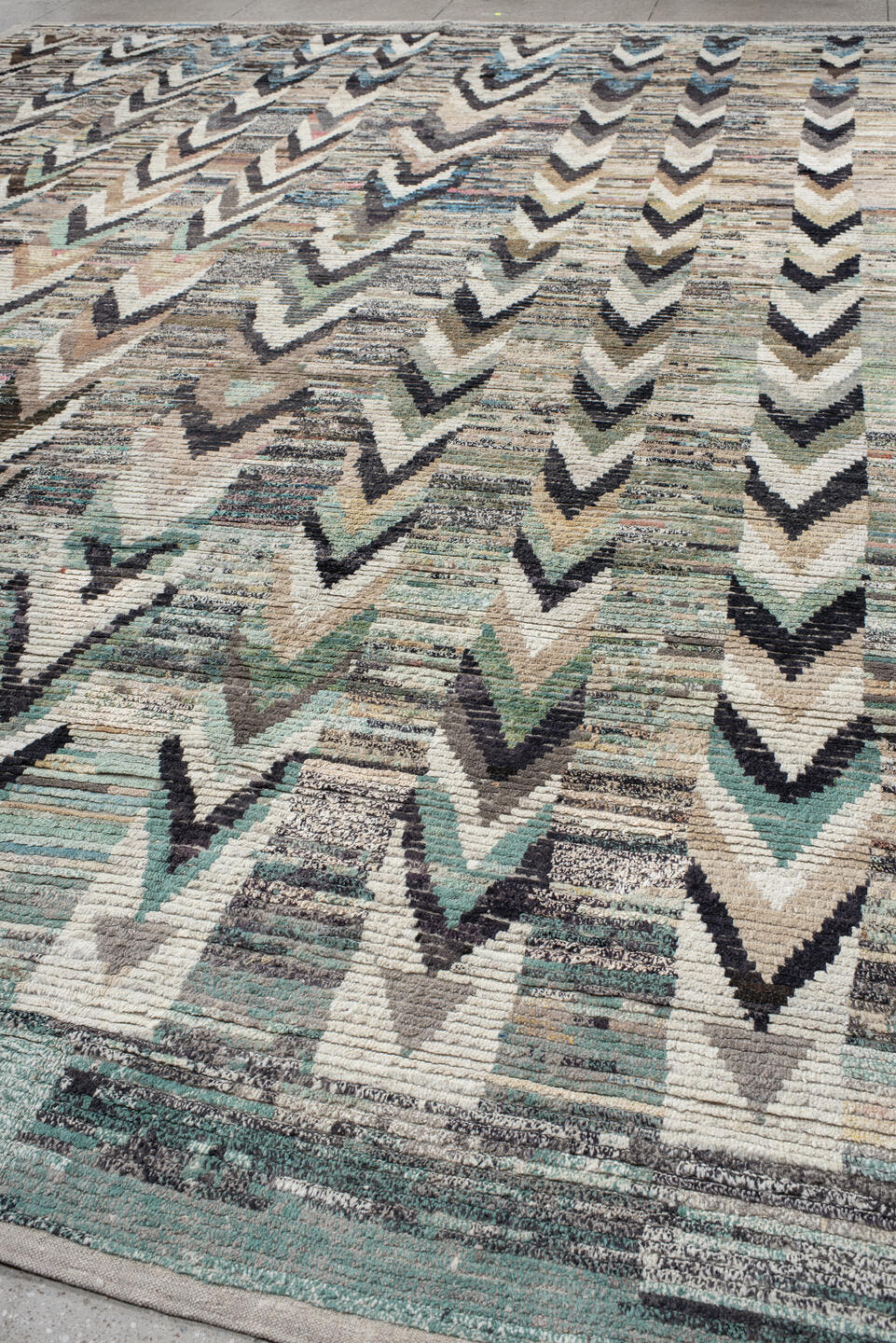 13' x 17' one-of-a-kind handmade vintage Tulu oversize rug. Color palette: ivory, gray, charcoal, aqua, taupe, sage, cream