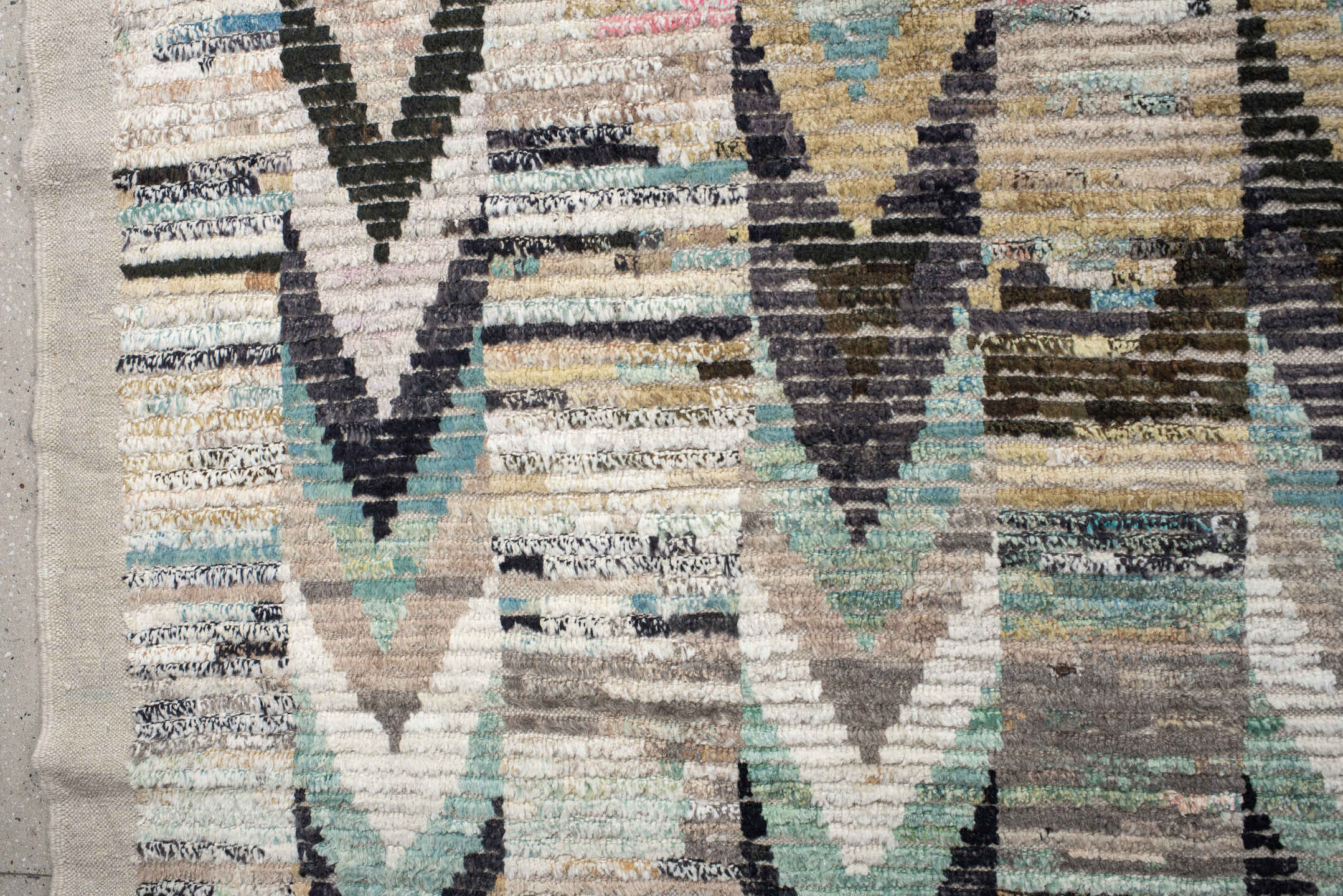 13' x 17' one-of-a-kind handmade vintage Tulu oversize rug. Color palette: ivory, gray, charcoal, aqua, taupe, sage, cream