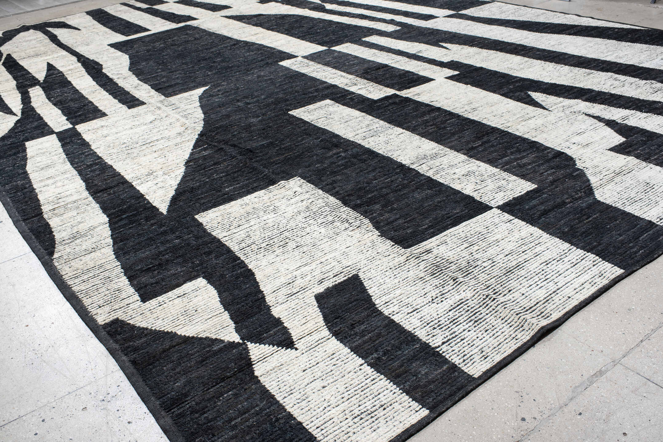 14' x 20' one-of-a-kind handmade vintage Tulu oversize rug. Color palette: ivory, charcoal, black, gray