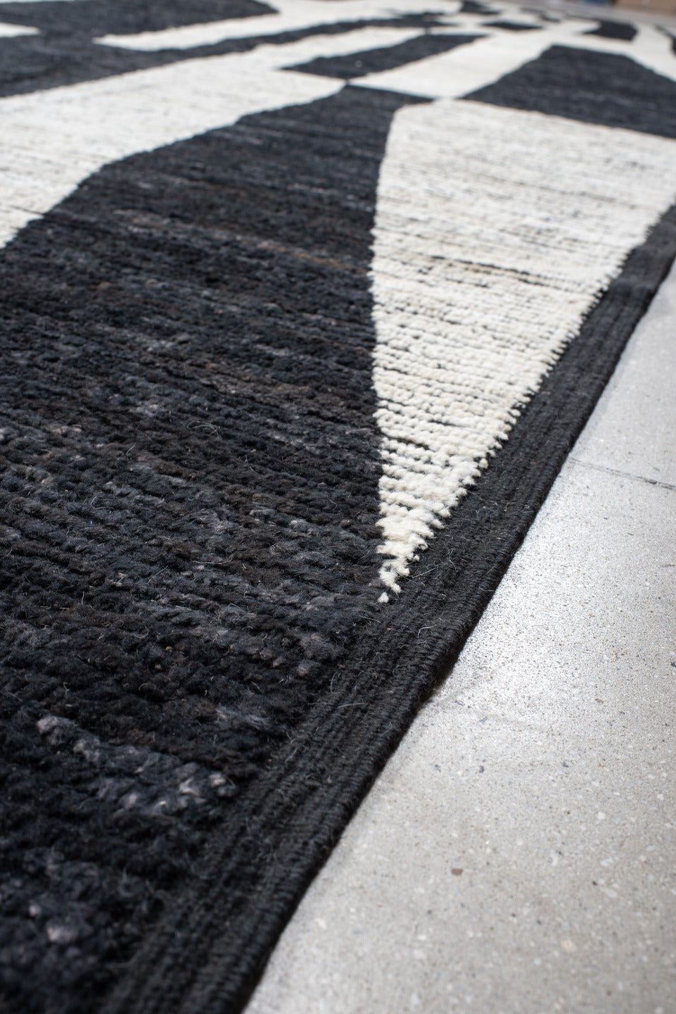 14' x 20' one-of-a-kind handmade vintage Tulu oversize rug. Color palette: ivory, charcoal, black, gray