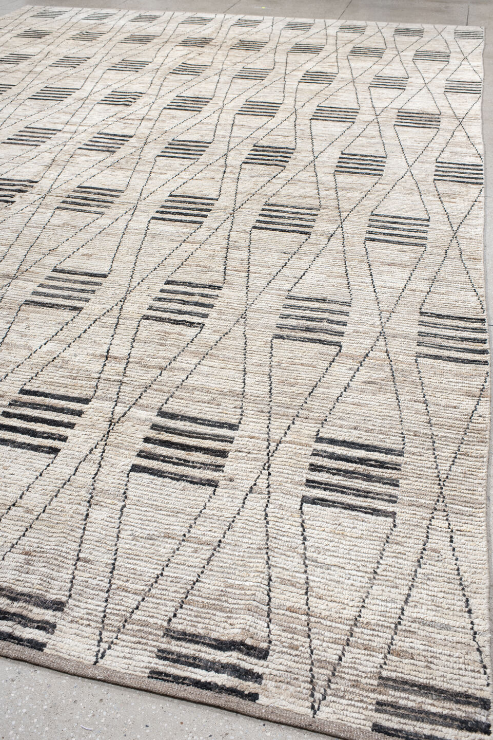 12' x 17' one-of-a-kind handmade vintage Tulu oversize rug. Color palette: ivory, charcoal, taupe, gray, black, beige