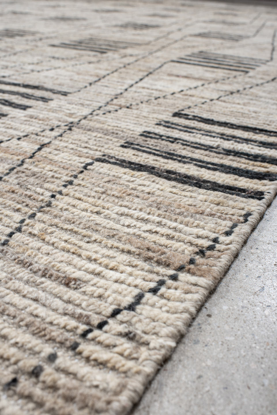 12' x 17' one-of-a-kind handmade vintage Tulu oversize rug. Color palette: ivory, charcoal, taupe, gray, black, beige