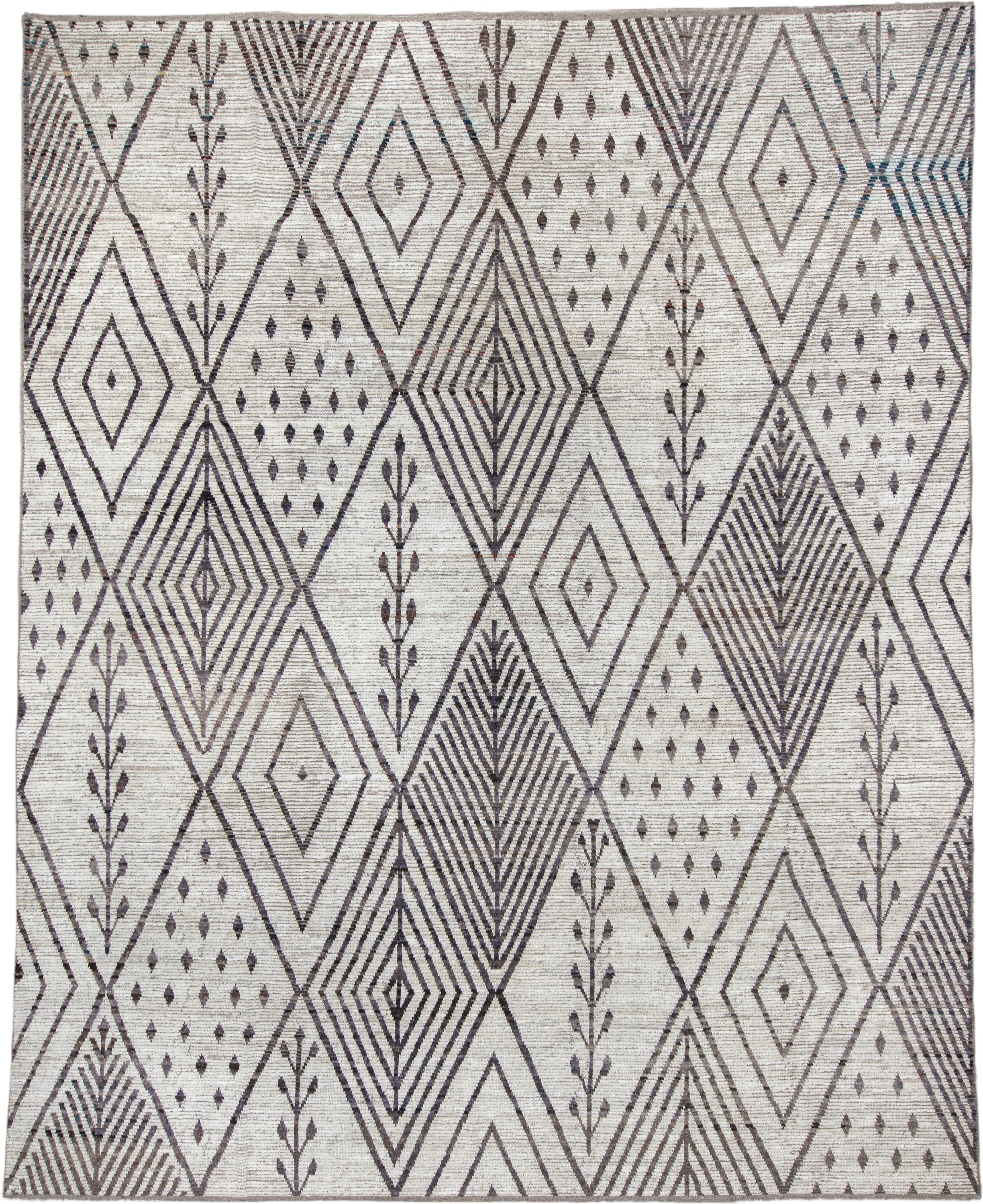 12' x 15' one-of-a-kind handmade vintage Tulu oversize rug. Color palette: ivory, charcoal, taupe, brown, gray, black, beige