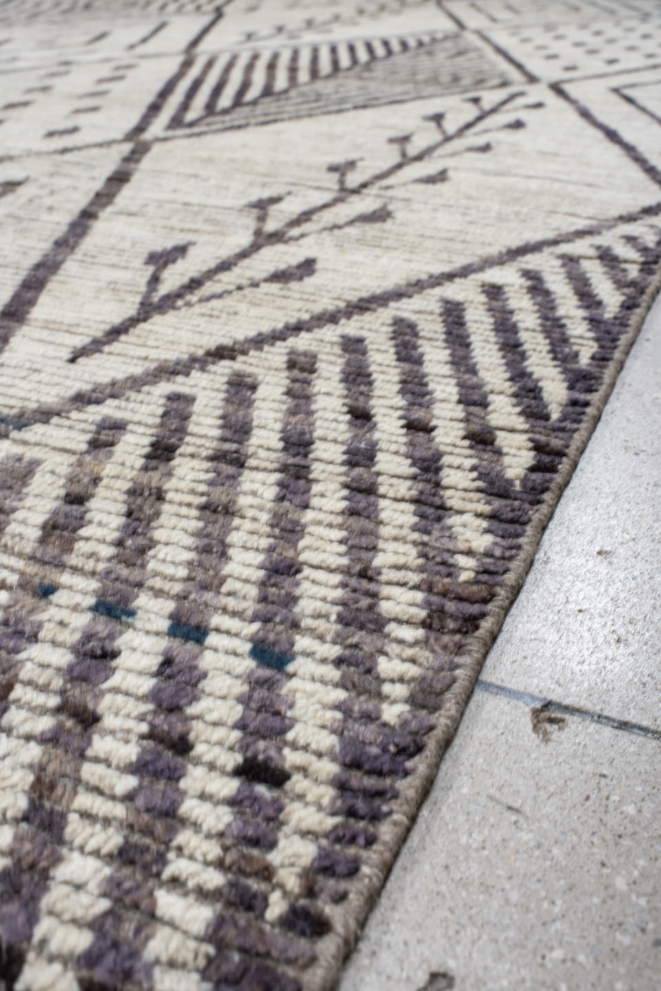 12' x 15' one-of-a-kind handmade vintage Tulu oversize rug. Color palette: ivory, charcoal, taupe, brown, gray, black, beige