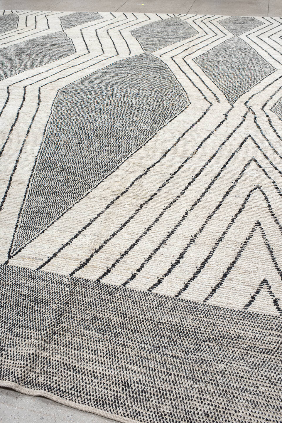 13' x 15' one-of-a-kind handmade vintage Tulu oversize rug. Color palette: ivory, charcoal, gray, black