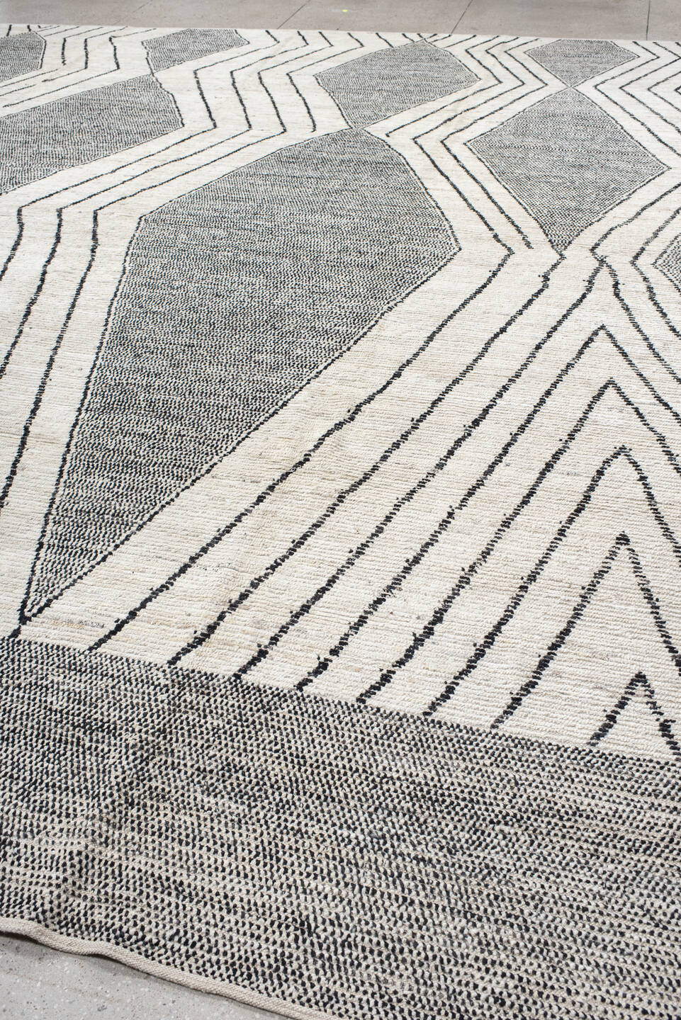 13' x 15' one-of-a-kind handmade vintage Tulu oversize rug. Color palette: ivory, charcoal, gray, black