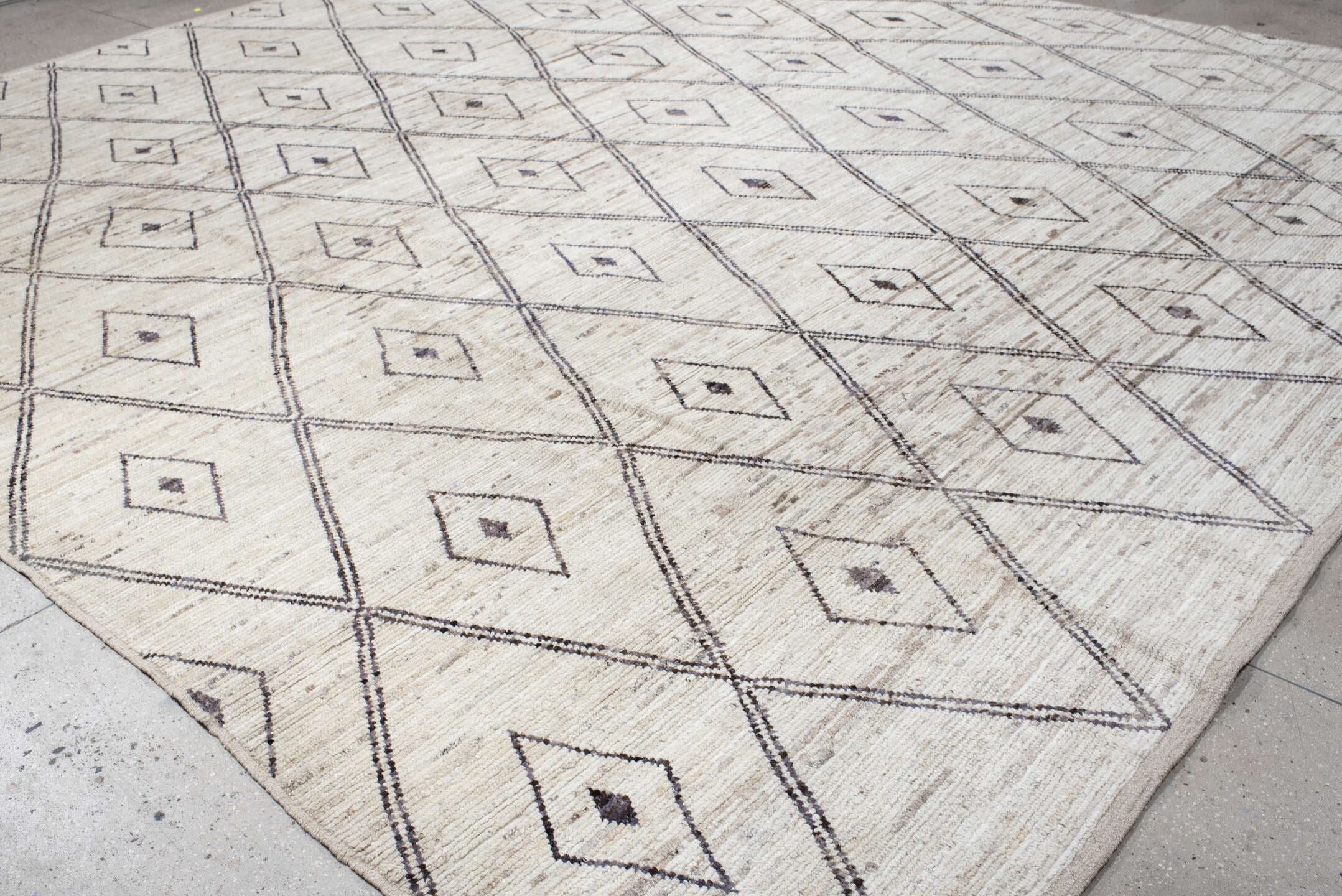 13' x 15' one-of-a-kind handmade vintage Tulu oversize rug. Color palette: ivory, taupe, charcoal, beige, gray, black