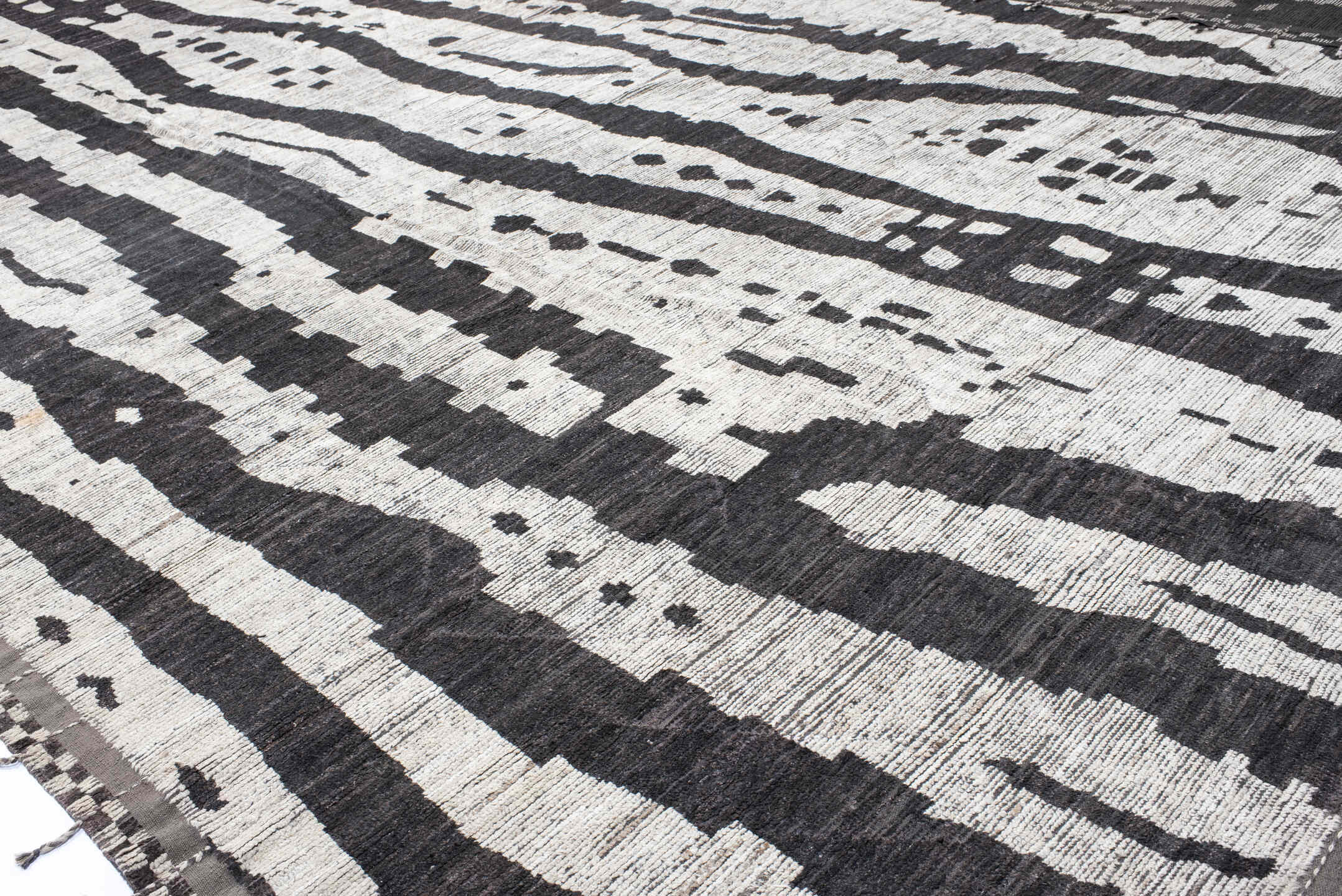 19' x 25' one-of-a-kind handmade vintage Tulu oversize rug. Color palette: ivory, charcoal, taupe, slate, gray, black, beige