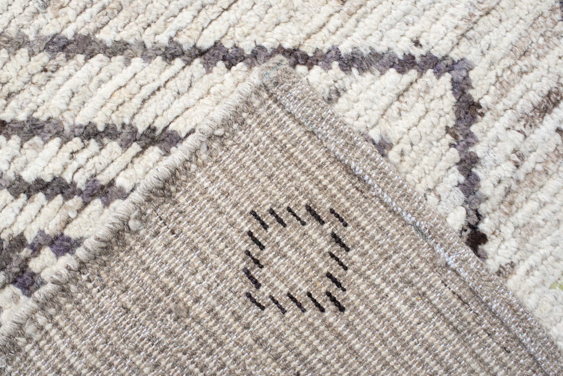 12' x 17' one-of-a-kind handmade vintage Tulu oversize rug. Color palette: ivory, charcoal, taupe, brown, gray, black, beige