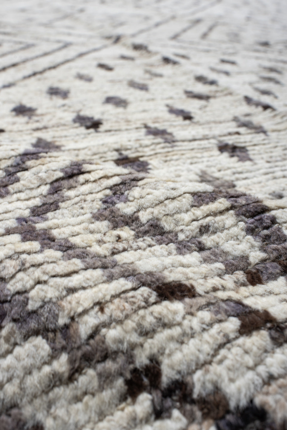 12' x 17' one-of-a-kind handmade vintage Tulu oversize rug. Color palette: ivory, charcoal, taupe, brown, gray, black, beige