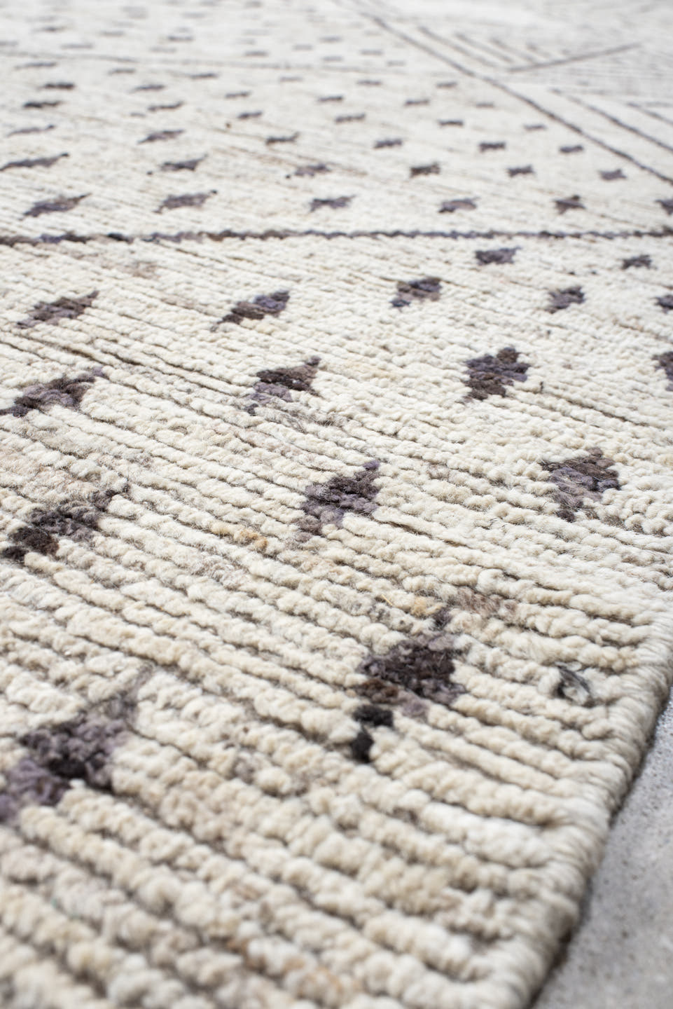 12' x 17' one-of-a-kind handmade vintage Tulu oversize rug. Color palette: ivory, charcoal, taupe, brown, gray, black, beige