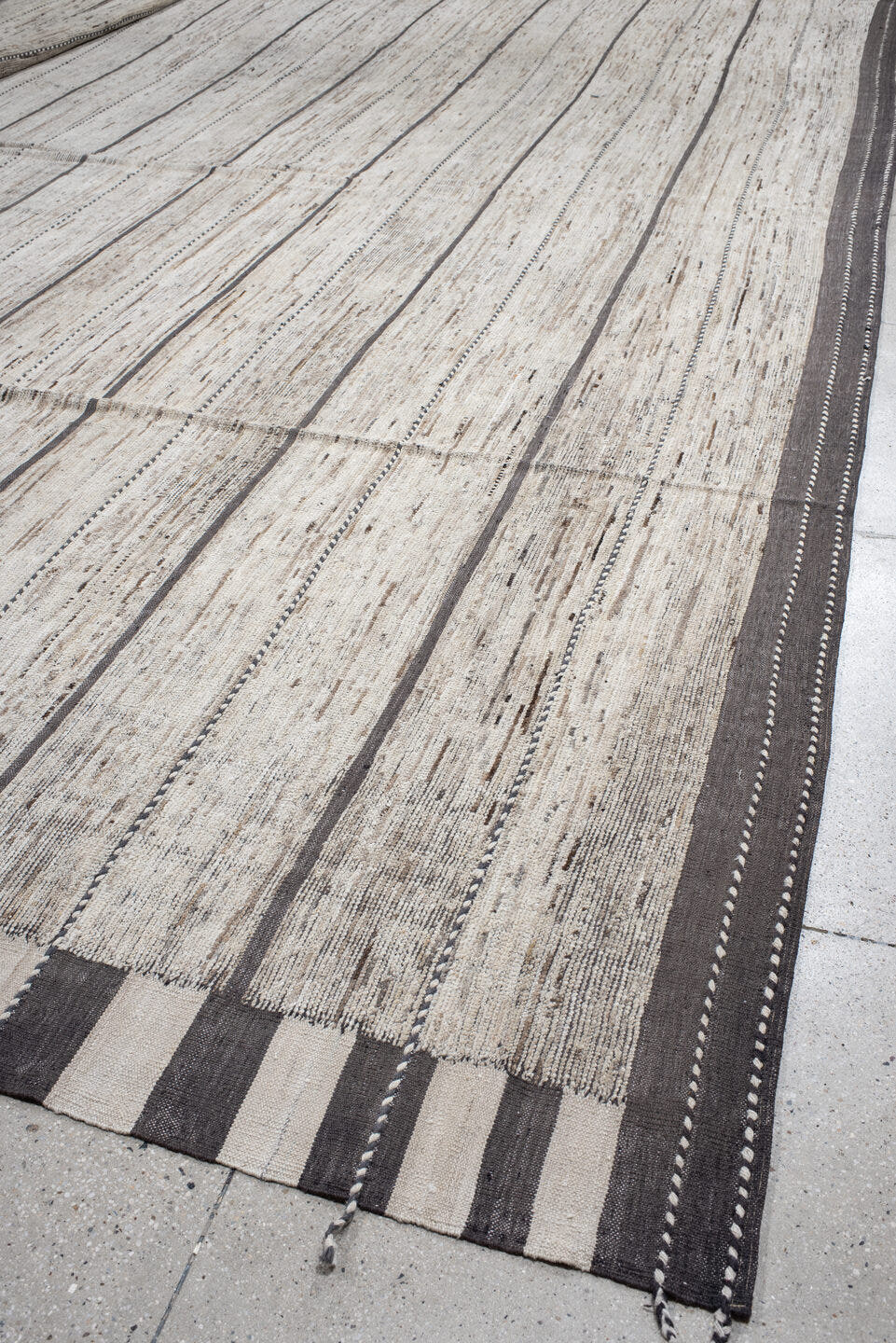 19' x 28' one-of-a-kind handmade vintage Tulu oversize rug. Color palette: ivory, charcoal, taupe, brown, gray, black, beige