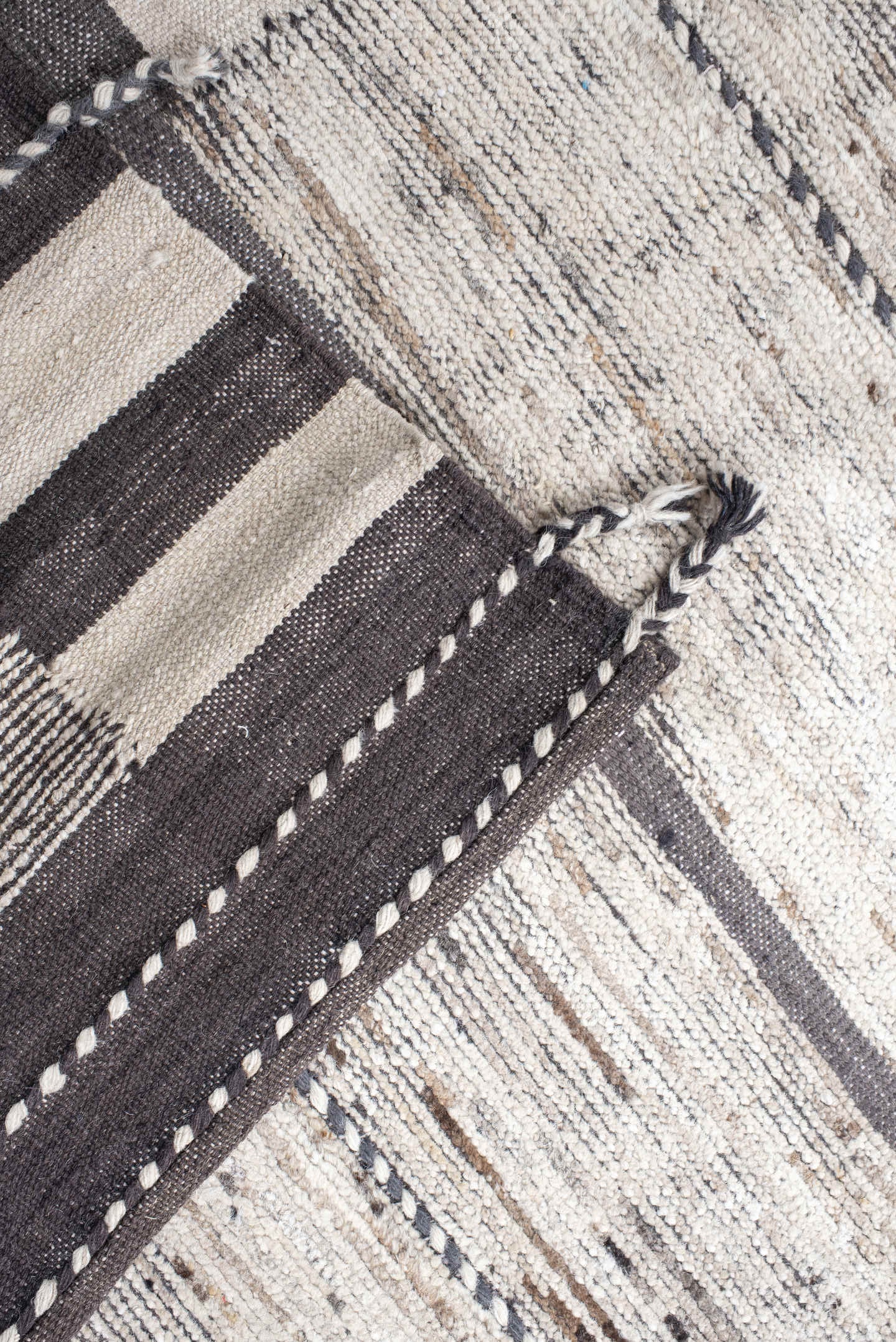 19' x 28' one-of-a-kind handmade vintage Tulu oversize rug. Color palette: ivory, charcoal, taupe, brown, gray, black, beige