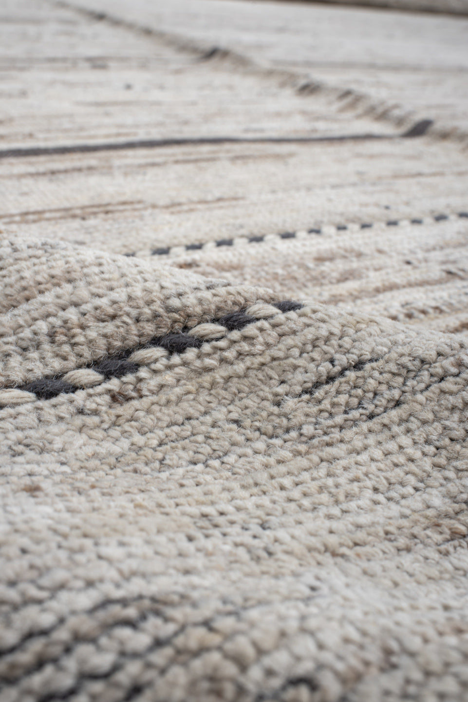 19' x 28' one-of-a-kind handmade vintage Tulu oversize rug. Color palette: ivory, charcoal, taupe, brown, gray, black, beige