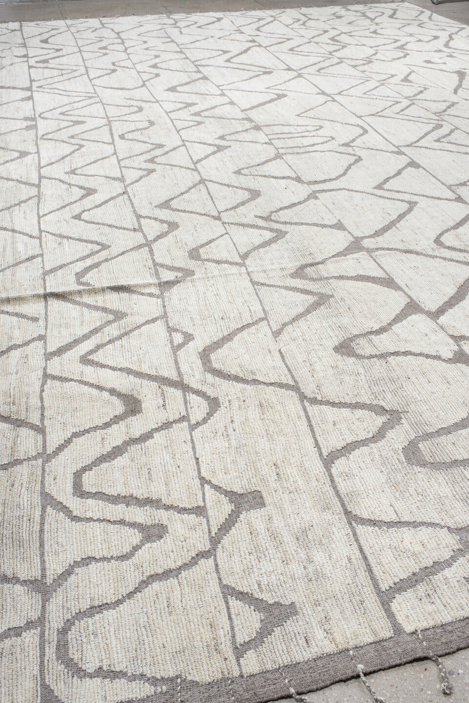 20' x 24' one-of-a-kind handmade vintage Tulu oversize rug. Color palette: ivory, gray, taupe, beige