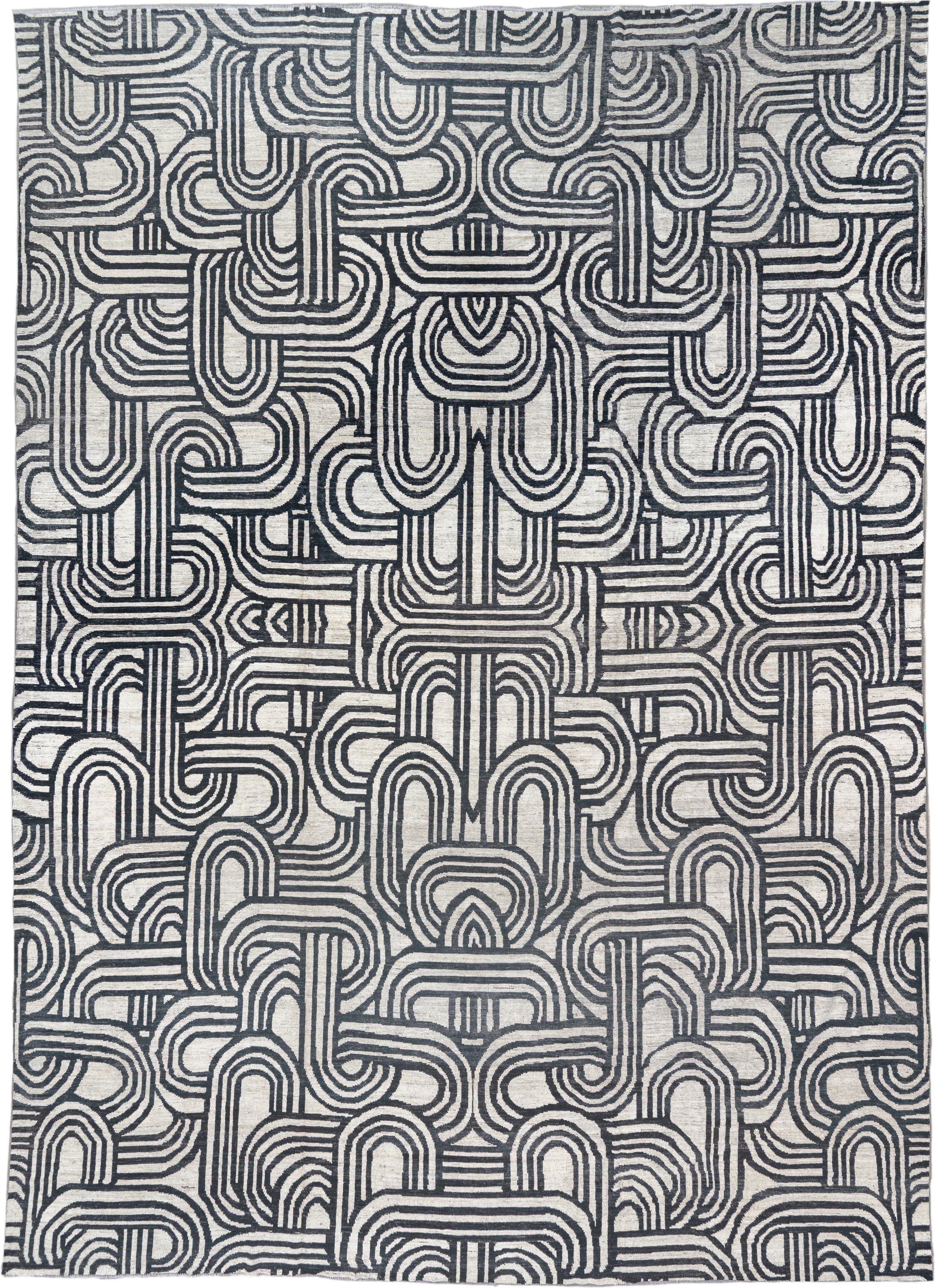 16' x 22' one-of-a-kind handmade vintage Tulu oversize rug. Color palette: ivory, charcoal, gray, black