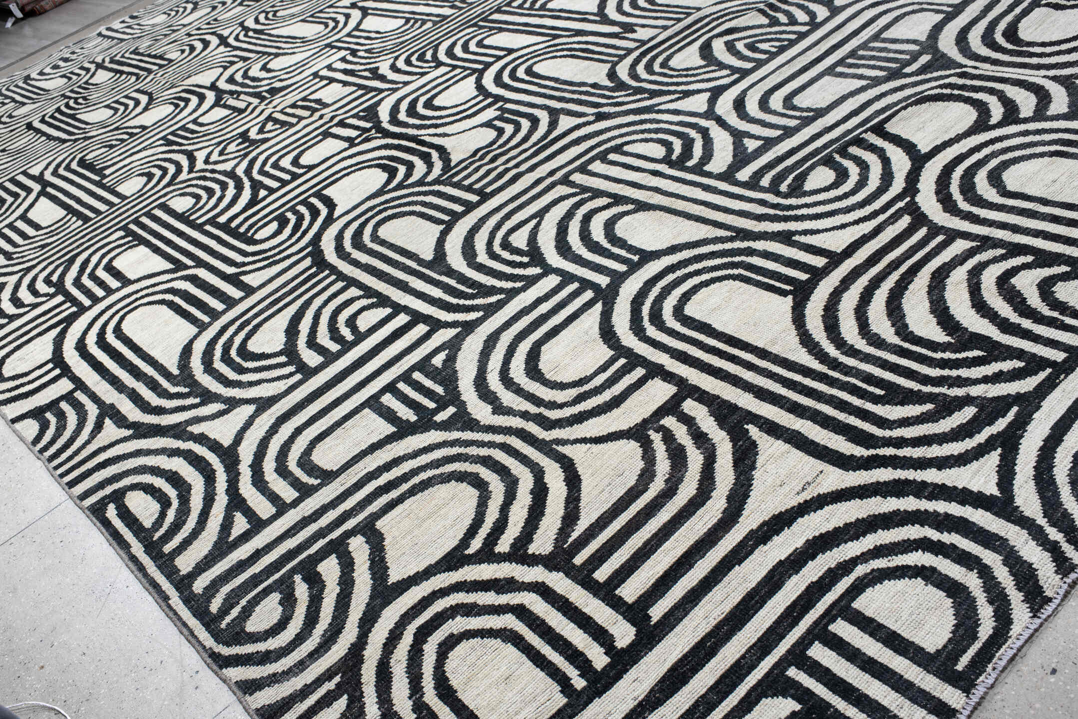 16' x 22' one-of-a-kind handmade vintage Tulu oversize rug. Color palette: ivory, charcoal, gray, black
