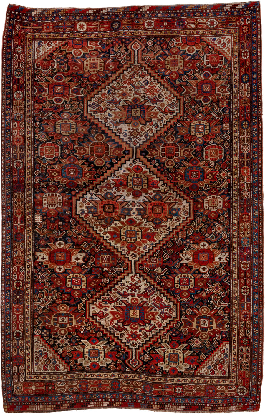 7' x 9' one-of-a-kind handmade vintage Tulu large size rug. Color palette: rust, ivory, navy, crimson, camel, charcoal