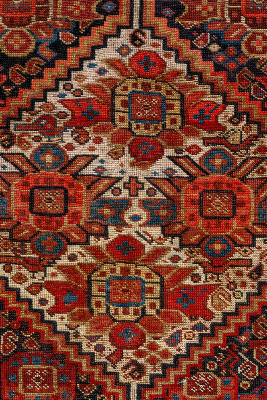 7' x 9' one-of-a-kind handmade vintage Tulu large size rug. Color palette: rust, ivory, navy, crimson, camel, charcoal
