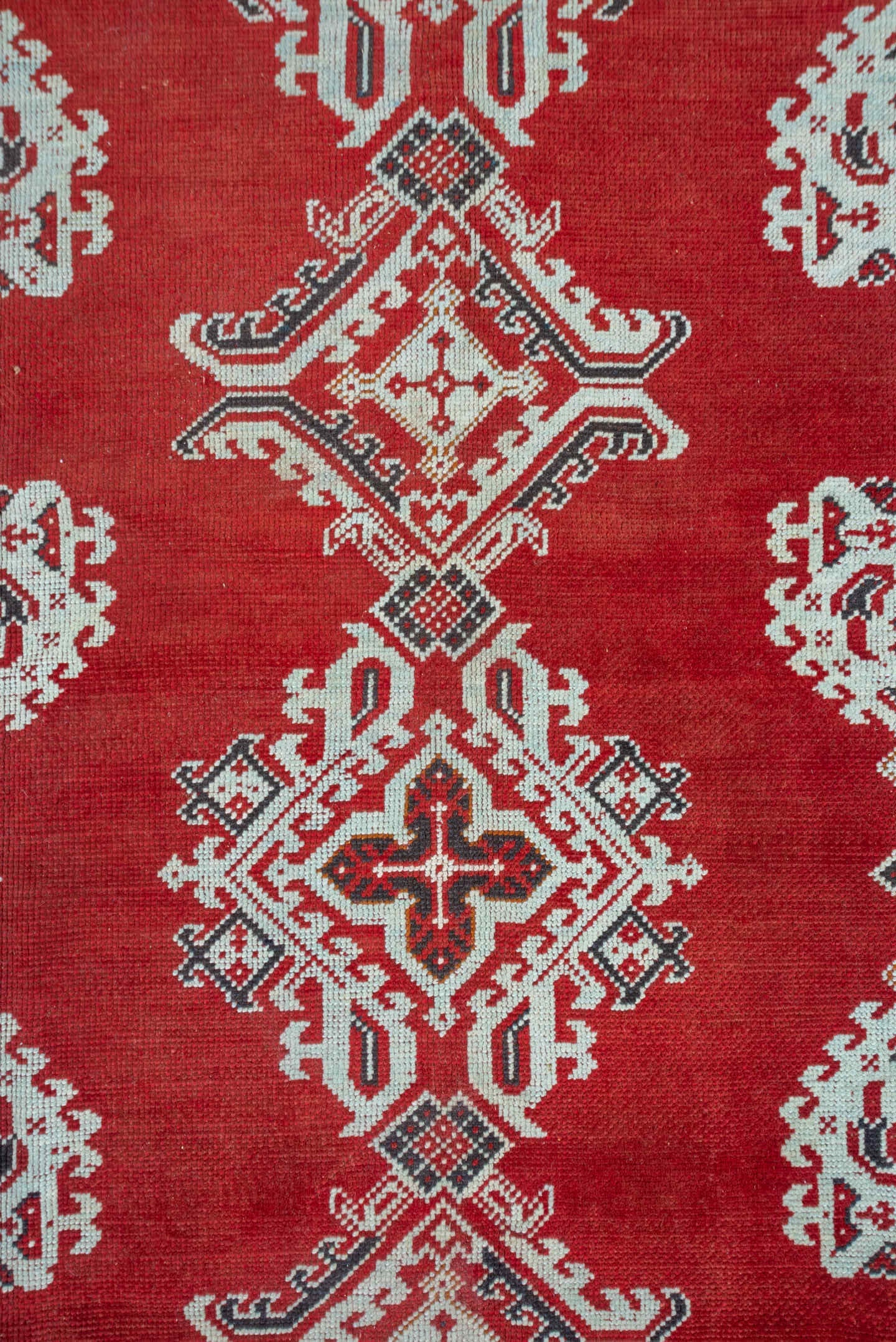 3' x 11' one-of-a-kind handmade vintage Tulu runner rug. Color palette: terracotta, ivory, crimson, charcoal, brown, red