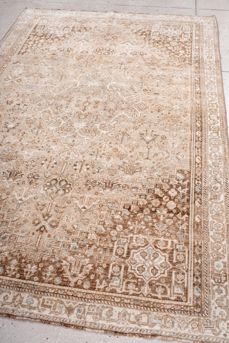 5' x 8' one-of-a-kind handmade vintage Shiraz medium size rug. Color palette: taupe, ivory, camel, beige, light brown