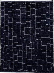 7' x 9' one-of-a-kind handmade vintage Moroccan rug. Color palette: black, ivory