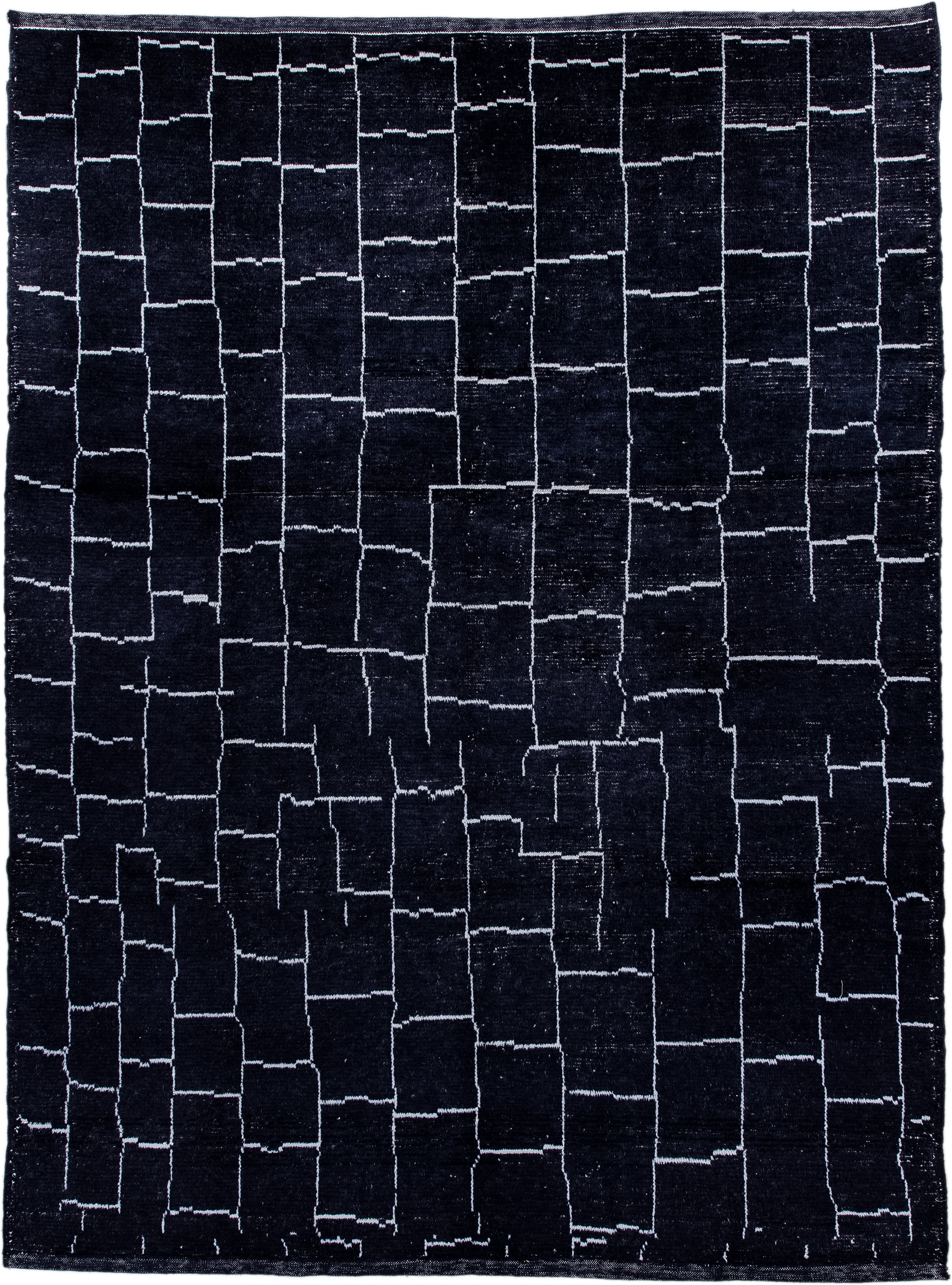 7' x 9' one-of-a-kind handmade vintage Moroccan rug. Color palette: black, ivory