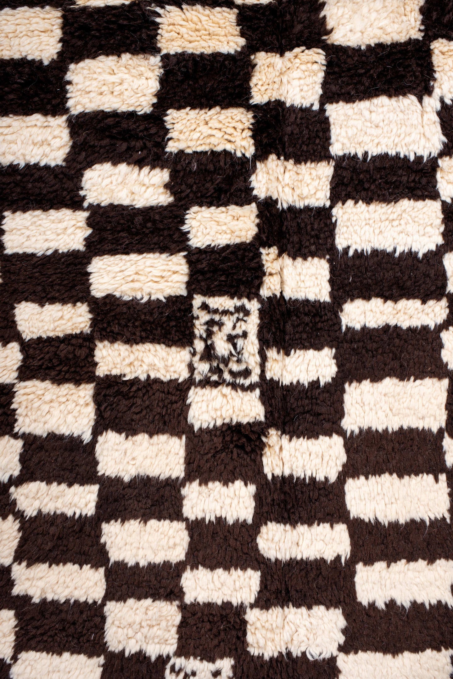 7' x 9' one-of-a-kind handmade vintage Moroccan rug. Color palette: ivory, brown, black, cream